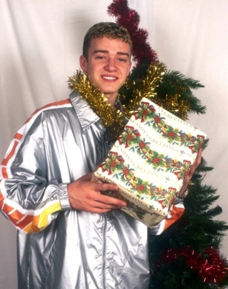 Justin Timberlake holding a Christmas present